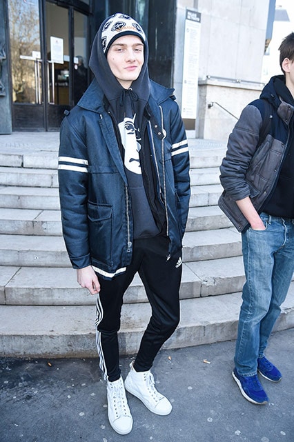 Street-styler in classic adidas tracksuit bottoms and a dark graphic hoodie and coat | ASOS Style Feed