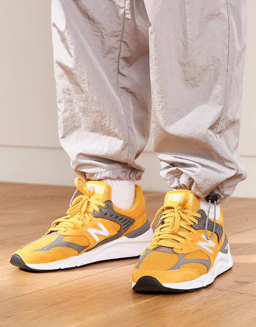 A close-up of Nawal's New Balance trainers | ASOS Style Feed