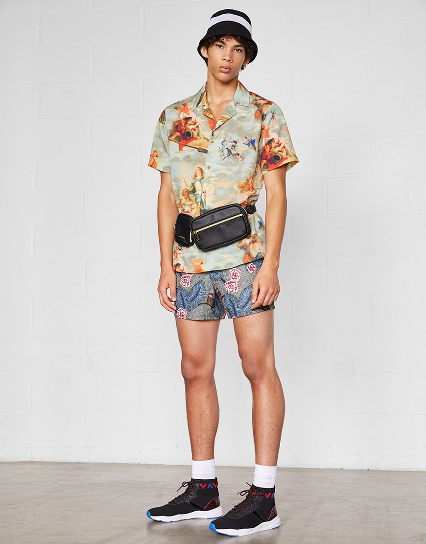 A model wearing a bucket hat, revere-collar shirt, bum bag, swim shorts and hi-top trainers | ASOS Style Feed