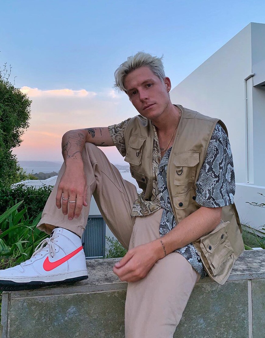 A picture of an ASOS Insider wearing a tonal outfit.