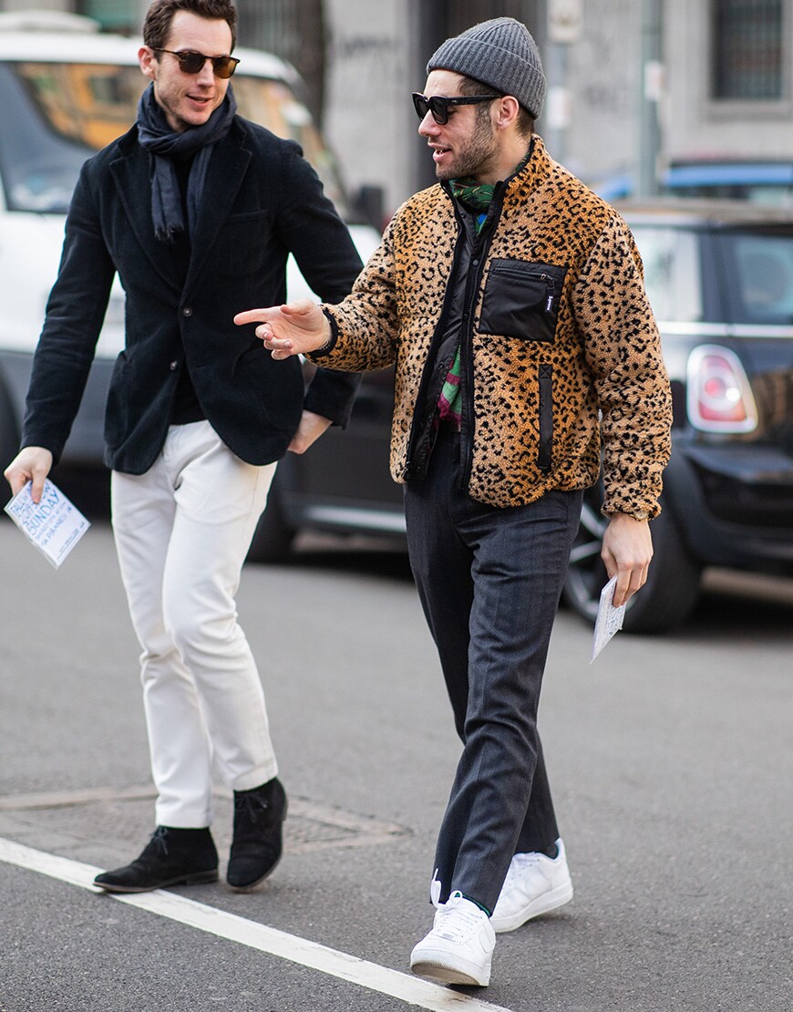 A picture of a street styler wearing a leopard print fleece.