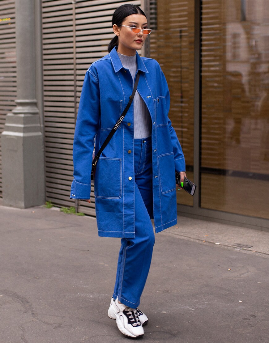 A picture of a female street styler wearing a tonal outfit.