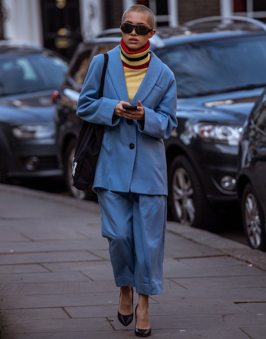 A street styler in a bold suit