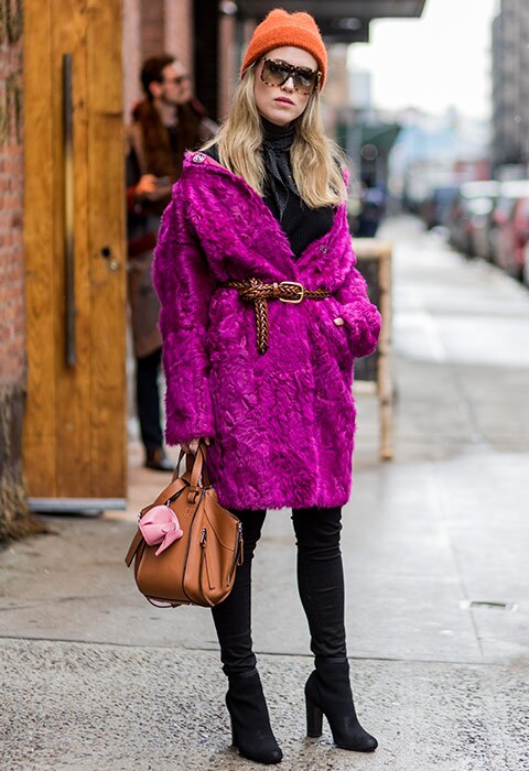 Blogger Annabel Rosendahl wearing purple faux-fur coat, over-the-knee boots and brown bag | ASOS Fashion & Beauty Feed