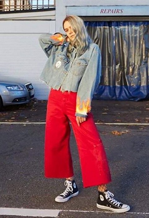 ASOS insider Olive wearing red skater jeans. Available at ASOS