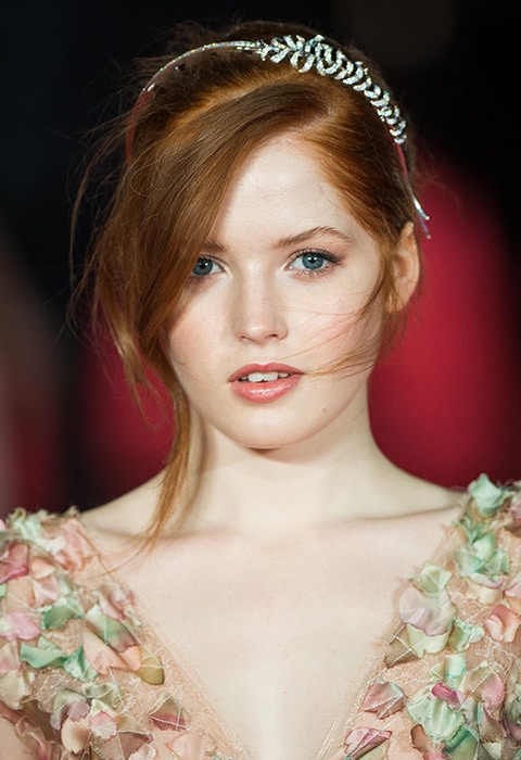 Ellie Bamber with a swept back hairstyle and side-parted fringe, wearing a tiara | ASOS Fashion & Beauty Feed