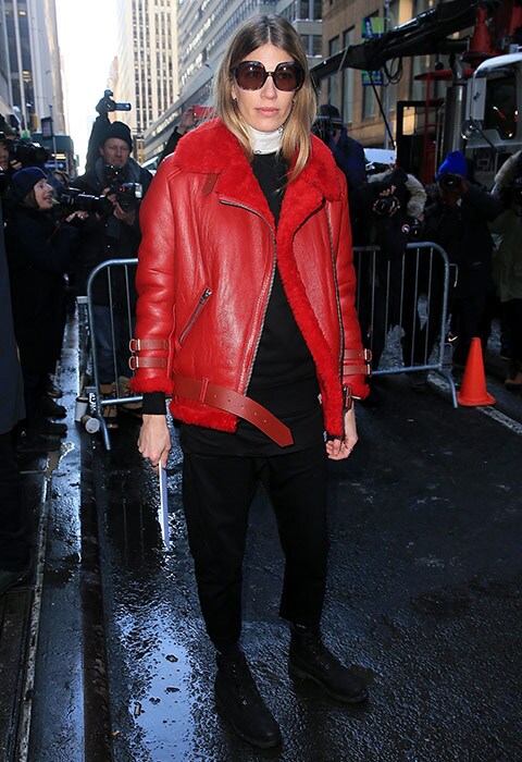 Veronika Heilbrunner wearing a red Acne Studios shearling aviator and black combat boots outside the Calvin Klein show at New York Fashion Week | ASOS Fashion & Beauty Feed
