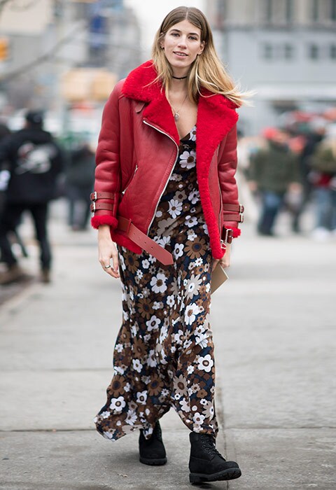 Veronika Heilbrunner wearing a floral print dress and red Acne Studios jacket outside Michael Kors during New York Fashion Week | ASOS Fashion & Beauty Feed