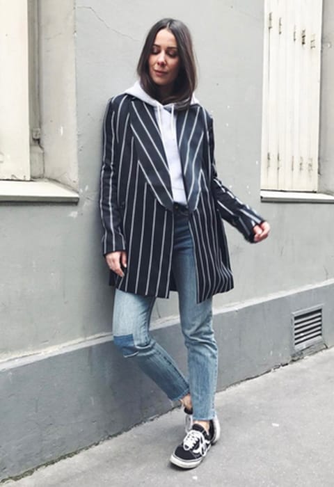 ASOS Alice wearing a navy and white pinstripe blazer over a grey hoodie | ASOS Fashion & Beauty Feed