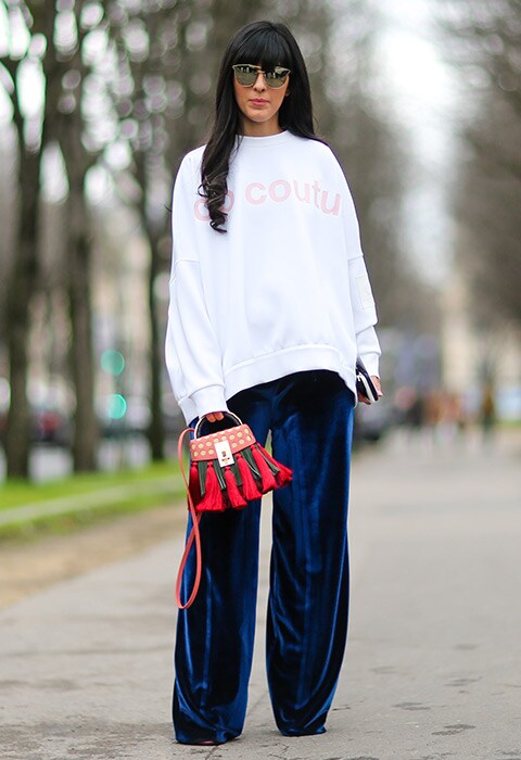 Blogger wearing blue velvet trousers, white oversized sweatshirt and mirrored sunglasses Rihanna wearing black denim wide-leg trousers and jacket | ASOS Fashion & Beauty Feed