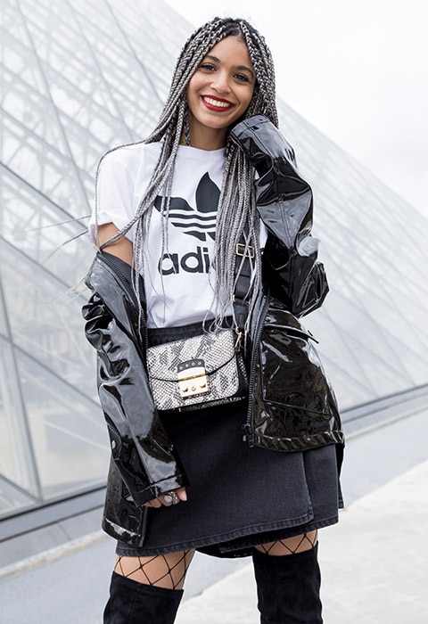 Blogger Syana from Paris wearing an adidas top, patent coat and black denim skirt | ASOS Fashion & Beauty Feed