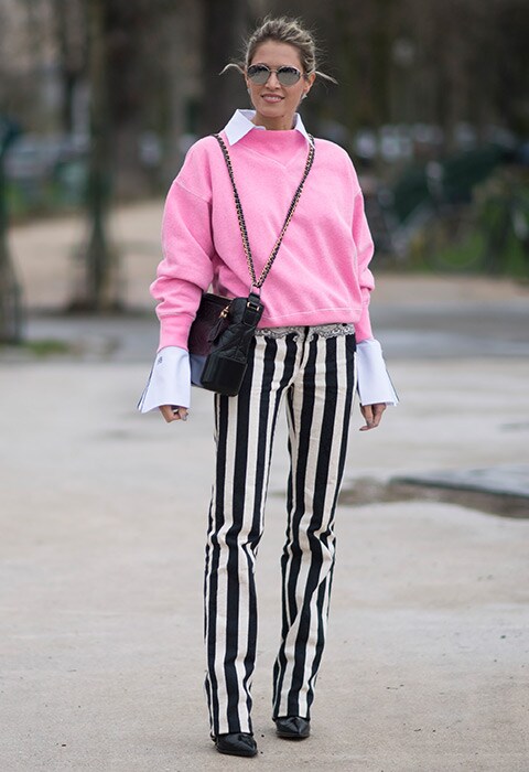 Helena Bordon wearing striped trousers with a contrasting jumper before the Chanel show during Paris Fashion Week AW17 | ASOS Fashion & Beauty Feed