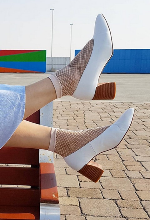 Blogger wearing nude fishnet socks and white heeled shoes available at ASOS | ASOS Fashion & Beauty Feed