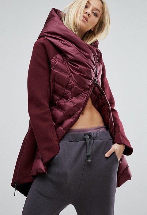 Model wearing maroon Nike Aeroloft padded longline jacket, available at ASOS | ASOS Fashion & Beauty Feed