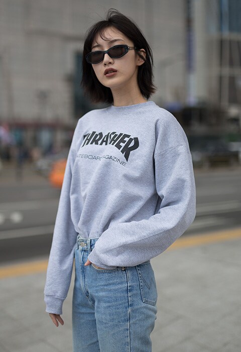 Blogger wearing a Thrasher jumper and mom jeans | ASOS Fashion & Beauty Feed