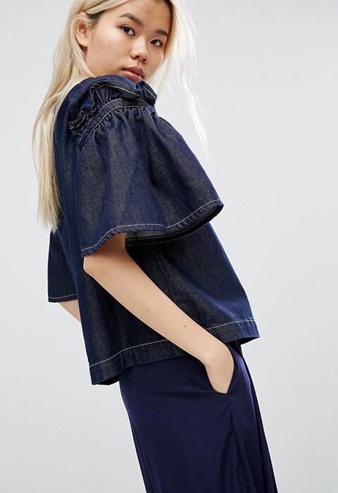 model wearing ASOS WHITE denim top with frill sleeve, available at ASOS