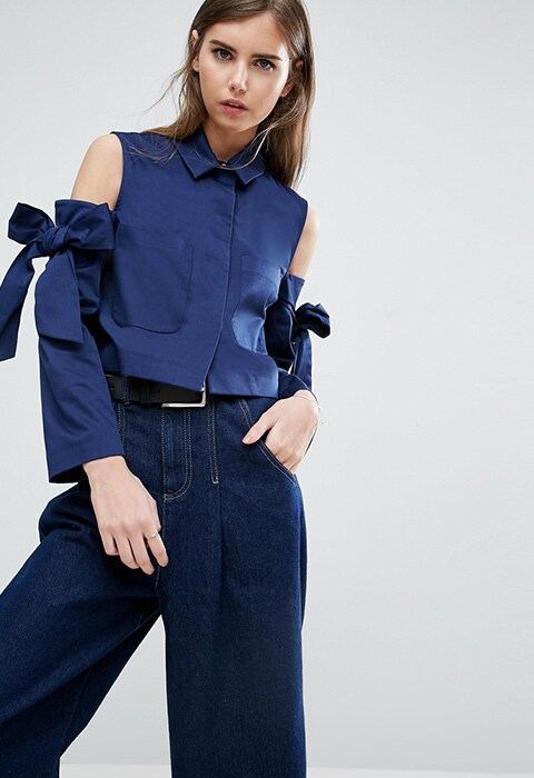 model wearing ASOS crop jacket with bow shoulder, available at ASOS