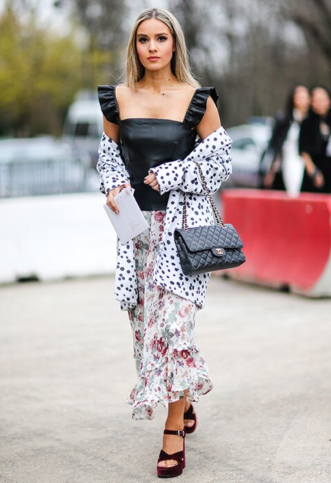 Street style blogger Pamela Cortes wearing leather top and print clash