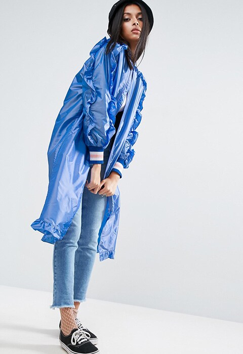 model wearing ASOS Long Rainmac With Frills, available at ASOS