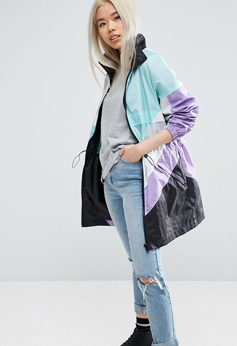 model wearing ASOS Longline Rain Mac In Colourblock, available at ASOS