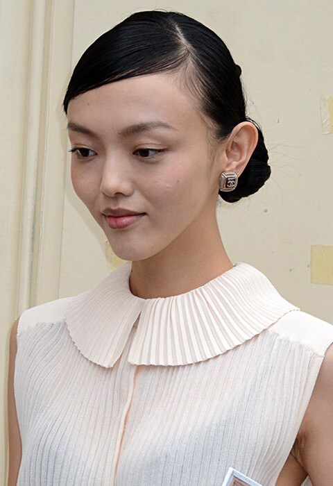 Japanese Model and Actress Rila Fukushima with sleek side parting and low bun hairstyle