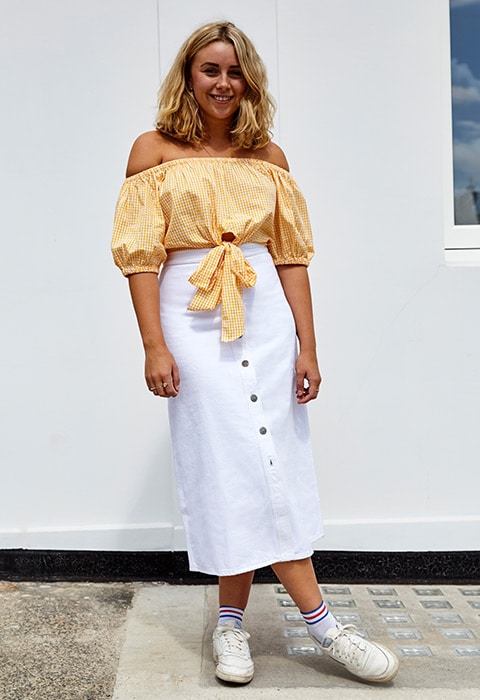 Anna Heaton junior editor and ASOS Insider wearing off-the-shoulder gingham top, white denim button-down midi skirt and Reebok trainers | ASOS Fashion and Beauty Feed
