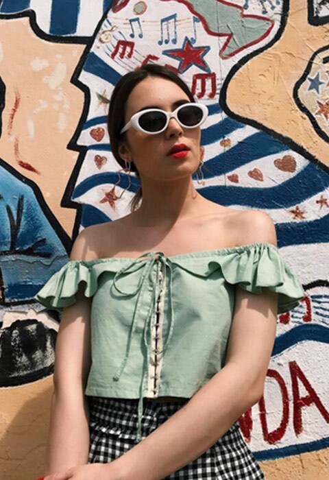 #AsSeenOnMe blogger wearing a green off-shoulder top and white sunglasses | ASOS Fashion & Beauty Feed