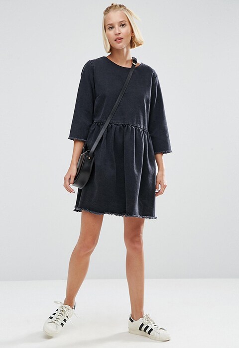 Model wearing ASOS denim smock dress with raw hem in washed black, available at ASOS | ASOS Fashion & Beauty Feed
