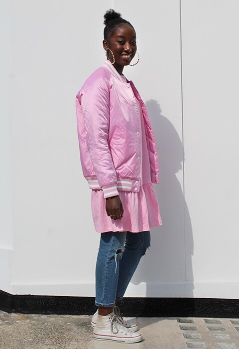 Estelle Adjei wearing pink Champion coach jacket and pink top, both available at ASOS | ASOS Fashion & Beauty Feed