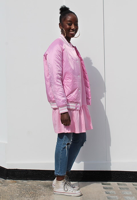 Estelle Adjei wearing pink Champion coach jacket and pink top, both available at ASOS | ASOS Fashion & Beauty Feed