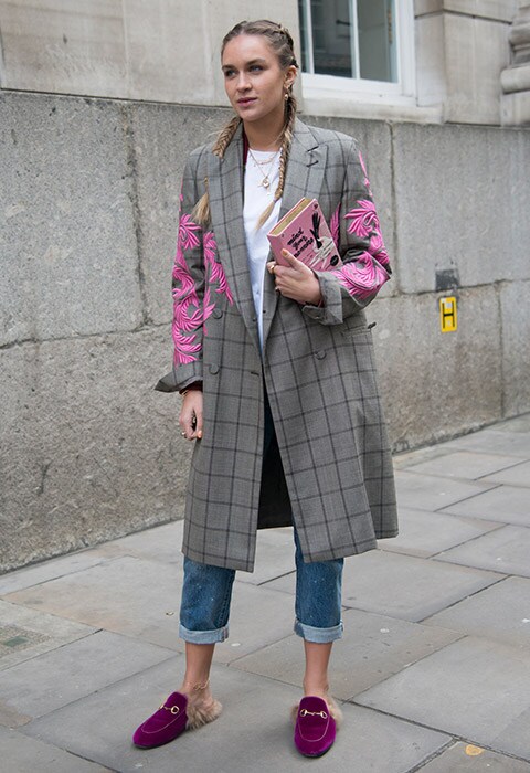 Blogger Nina Suess at London Fashion Week wearing Gucci mule loafers, oversized blazer, jeans and a white T-shirt | ASOS Fashion and Beauty Feed