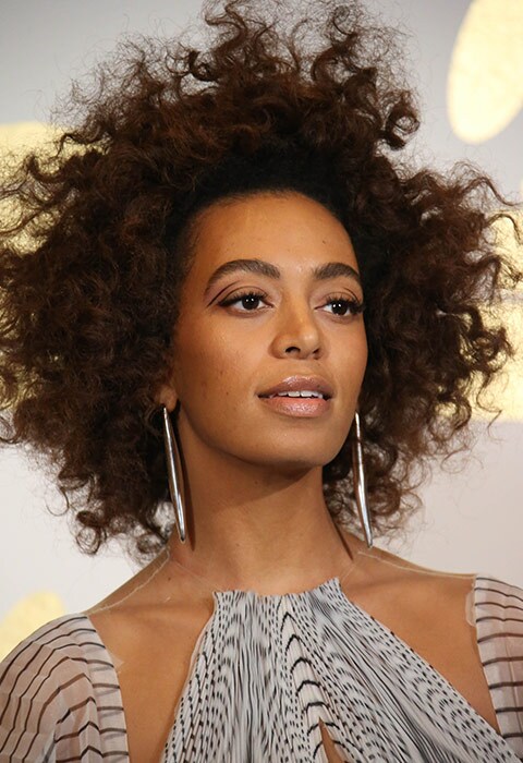 Solange Knowles wearing graphic liner and silver earrings.