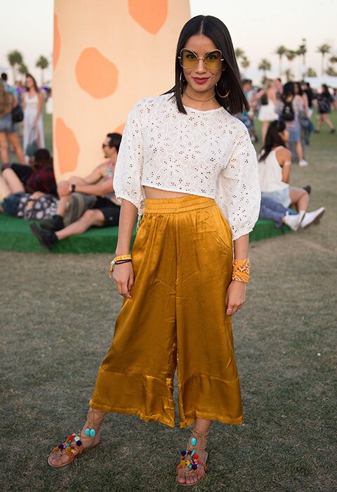 Festival goer at Coachella in mustard trousers | ASOS Fashion and Beauty Feed
