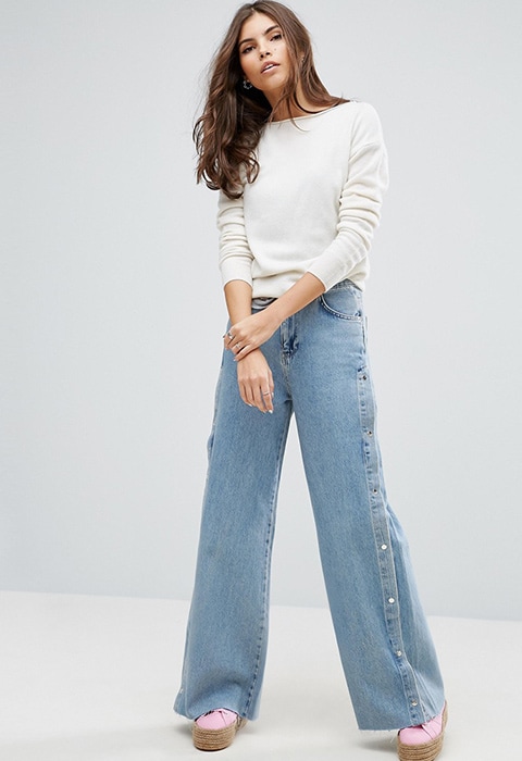 Model wearing Pull & Bear popper side jeans in light wash denim, available at ASOS | ASOS Fashion & Beauty Feed