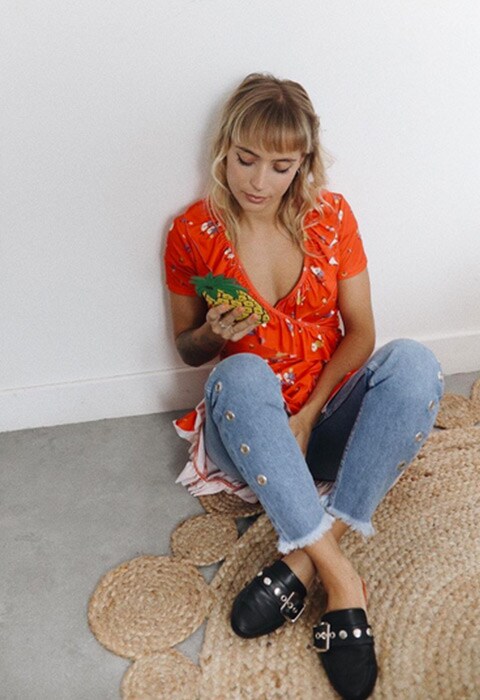 ASOS insider Astrid wearing a dress over jeans. Available at ASOS.