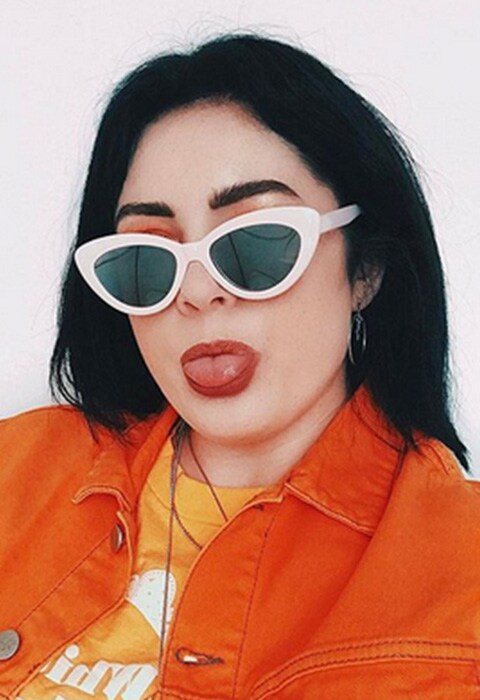 Blogger wearing an orange denim jacket. Available at ASOS.
