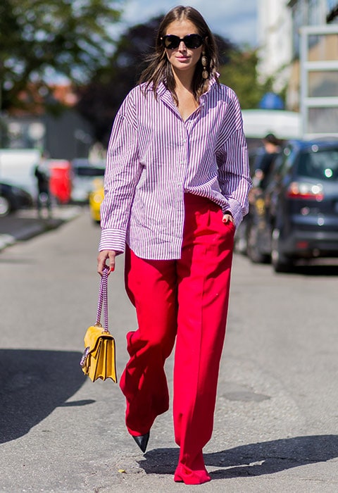 Darja Barannik wearings oversized striped shirt, wide-leg red trousers and pointed black heels to Copenhagen Fashion Week | ASOS Fashion and Beauty Feed