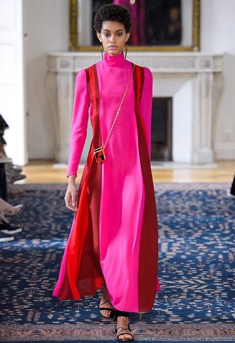 Valentino SS17 catwalk show model wearing bright pink maxi dress with red side stripes | ASOS Fashion & Beauty Feed