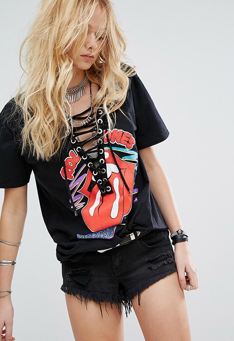 model wearing Reclaimed Vintage Inspired Band Rolling Stones T-Shirt With Lace Up Front, available on ASOS