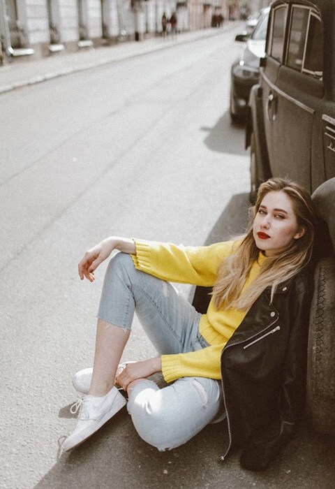 YouTube blogger Marie Novosad wearing a yellow jumper, grey jeans and white sneakers | ASOS Fashion & Beauty Feed