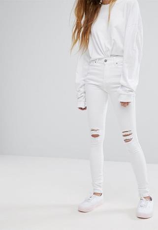 Model wearing white Dr Denim skinny jeans, available at ASOS  | ASOS Fashion & Beauty Feed