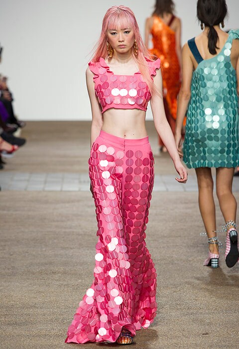 Model at House of Holland SS17 wears a pink sequin crop top and flares co-ord | ASOS Fashion & Beauty Feed