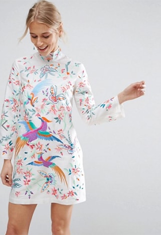 Model wearing an embroidered mini dress with high collar | ASO Fashion & Beauty Feed