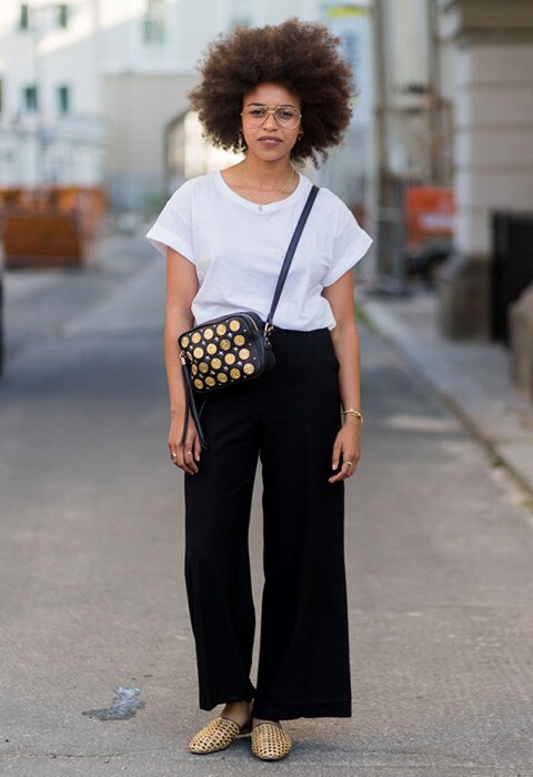Blogger at Berlin Fashion Week wearing a white tee and black trousers | ASOS Fashion & Beauty Feed