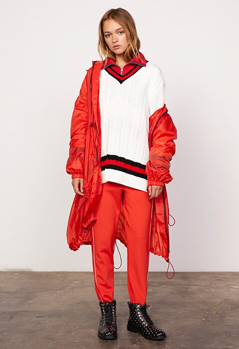 Cricket jumper with red tracksuit