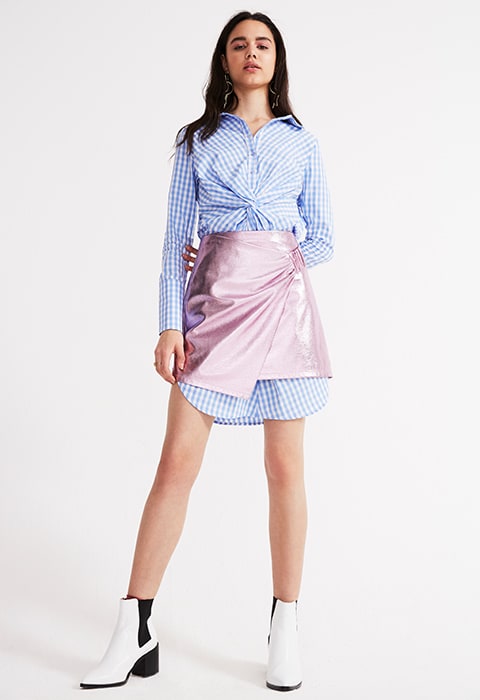 Model wearing a metallic skirt over a gingham shirt-dress | ASOS Fashion & Beauty Feed