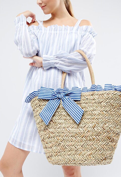 South Beach straw beach bag with blue and white striped ruffle detailing, available at ASOS | ASOS Fashion & Beauty Feed