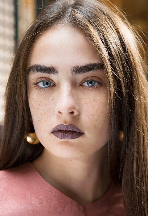 Model wearing brown 90s matte lipstick backstage at the catwalk show for Acne Studios SS17 | ASOS Fashion and Beauty Feed
