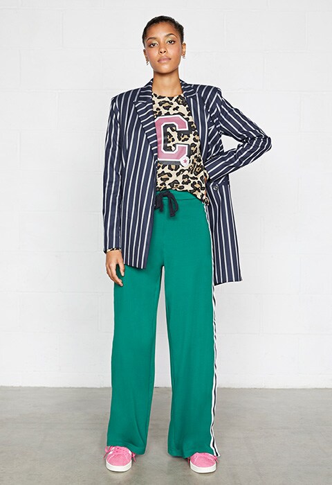Model wearing pinstripe blazer and tracksuit bottoms | ASOS Fashion & Beauty Feed