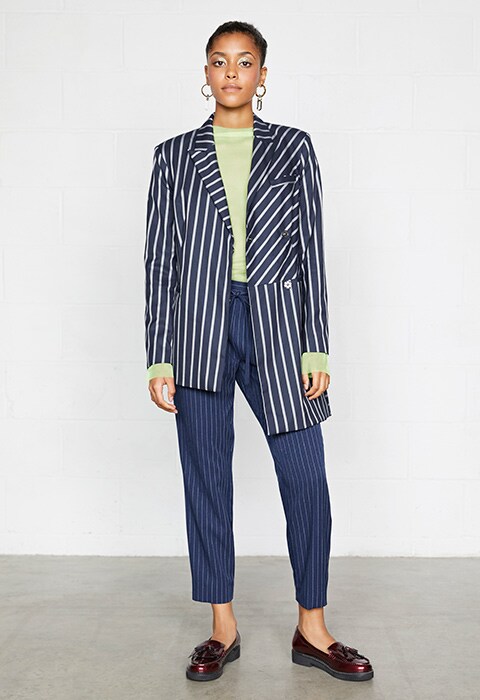 Model wearing pinstripe blazer and sheer top | ASOS Fashion & Beauty Feed